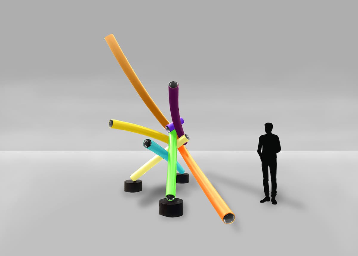 Colorful, intersecting tubes forming a modern art sculpture in San Antonio, with a silhouette of a person standing nearby for scale against a minimalist background.