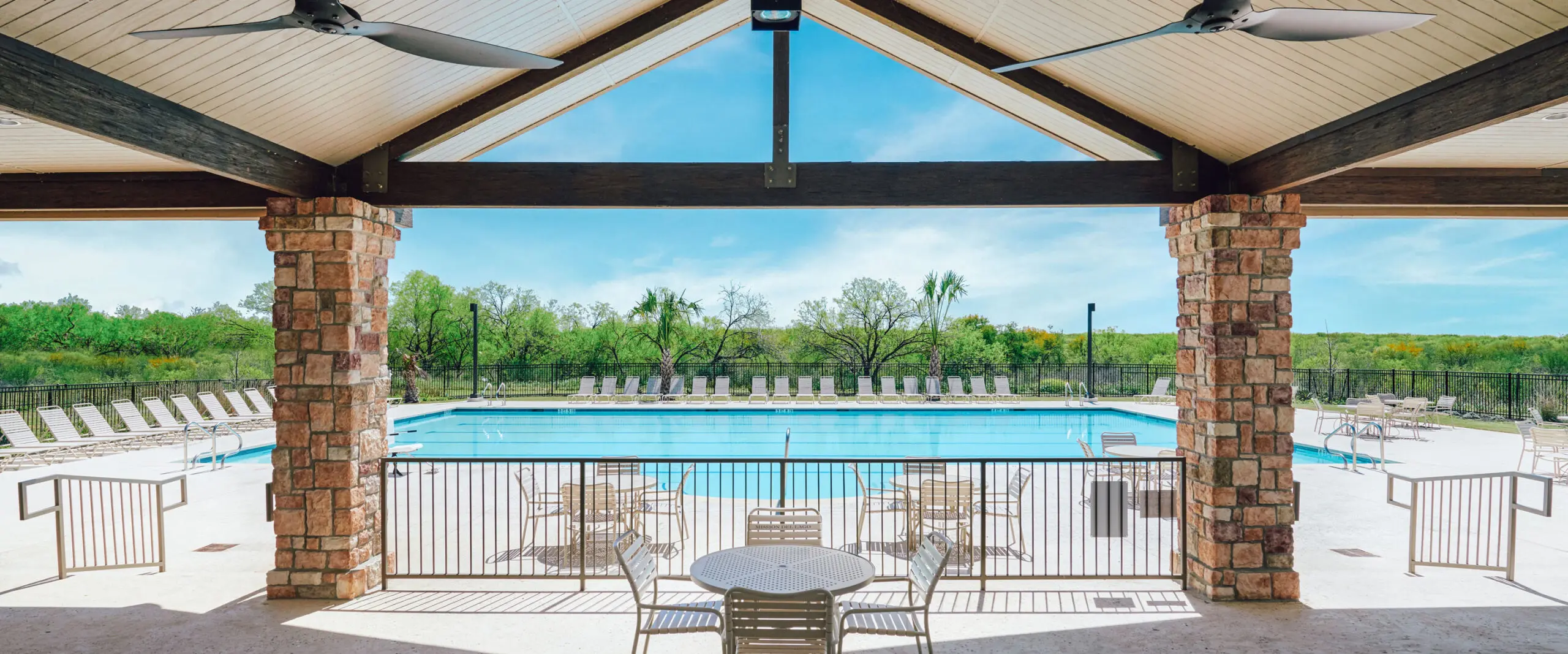 The Mission del Lago swimming pool with a covered patio.